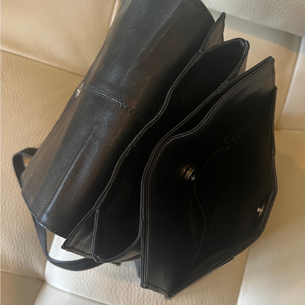 Radley Backpack in black leather with adjustable straps.